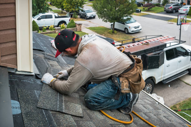 Professional Storm Damage Roof Repair technician working in Lowell, IN